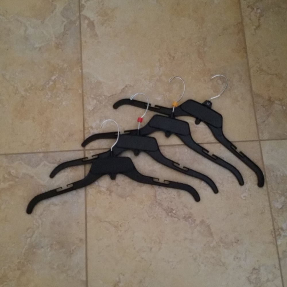 Four "stackable" black shirt hangers